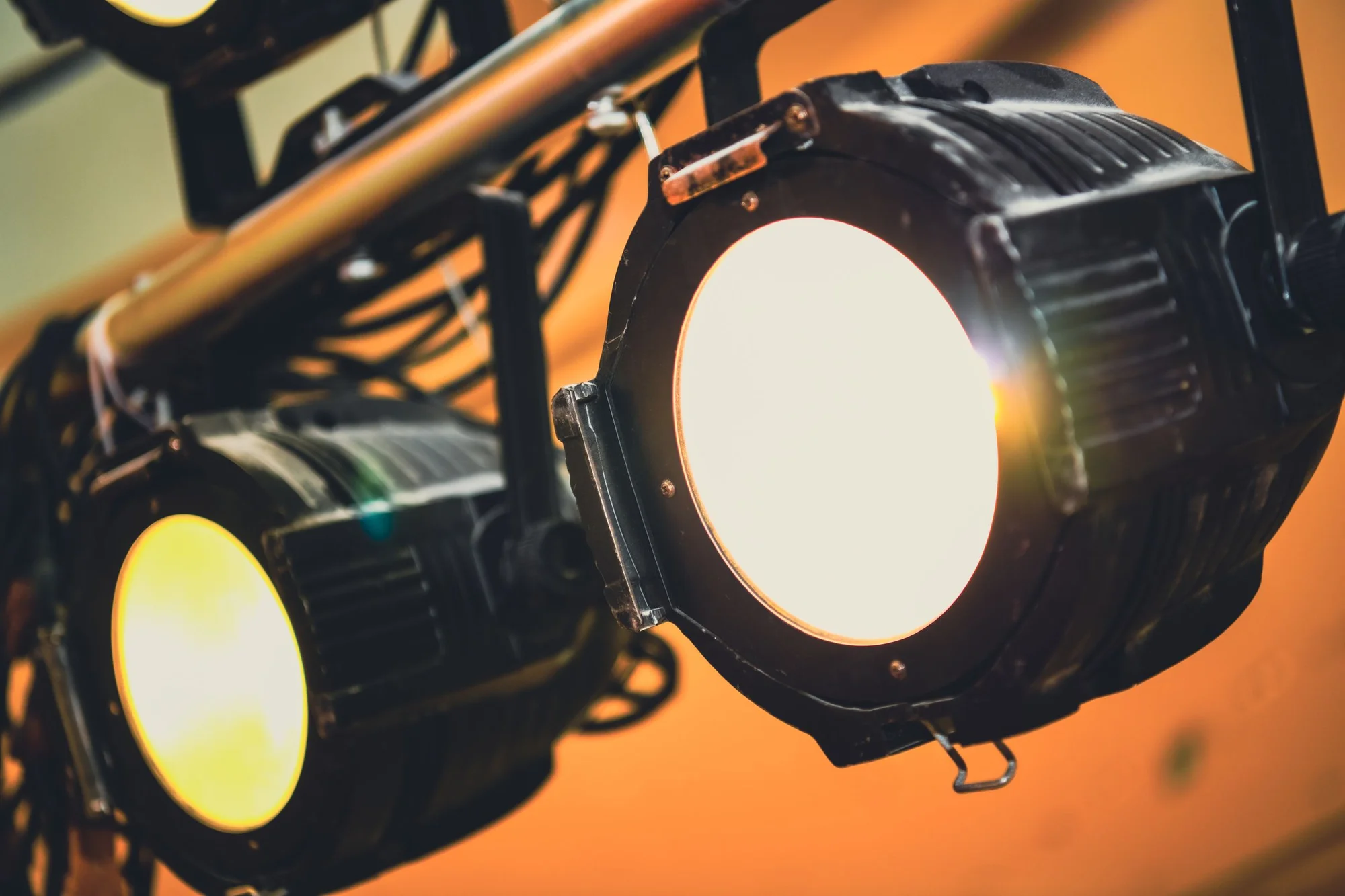 Theatre lanterns mounted on a lighting bar